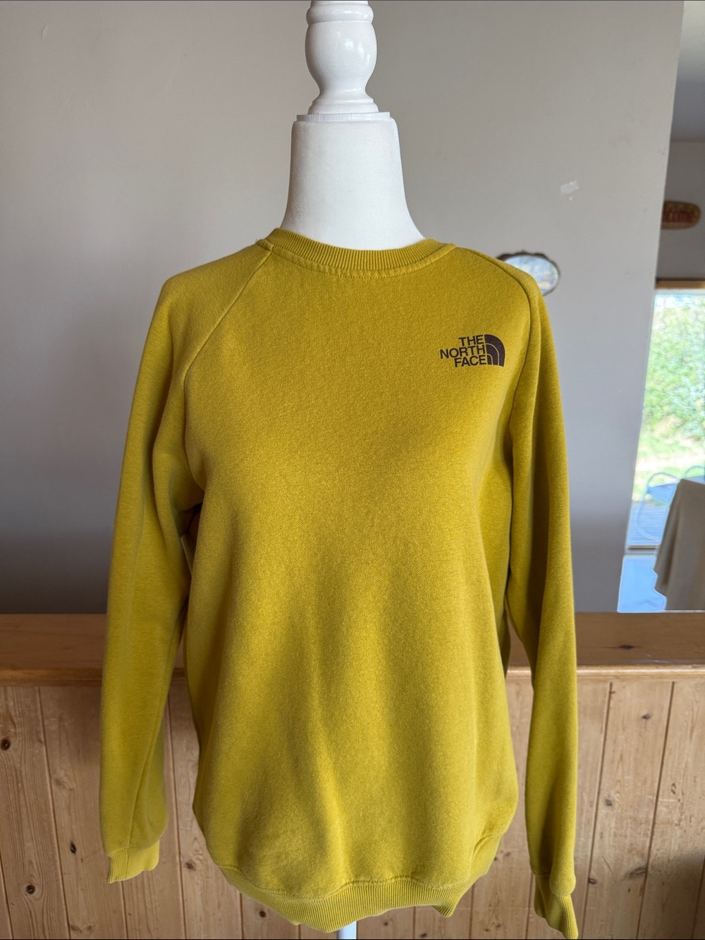 The North Face women's crewneck sweater in mustard